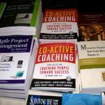 coactive coaching book nestled next to agile texts